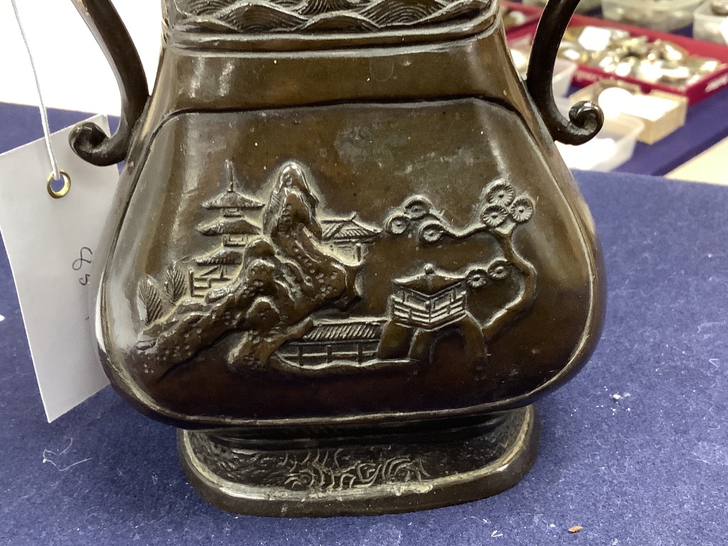 A Chinese bronze two handled flower vase, Ming dynasty, 24.5cm